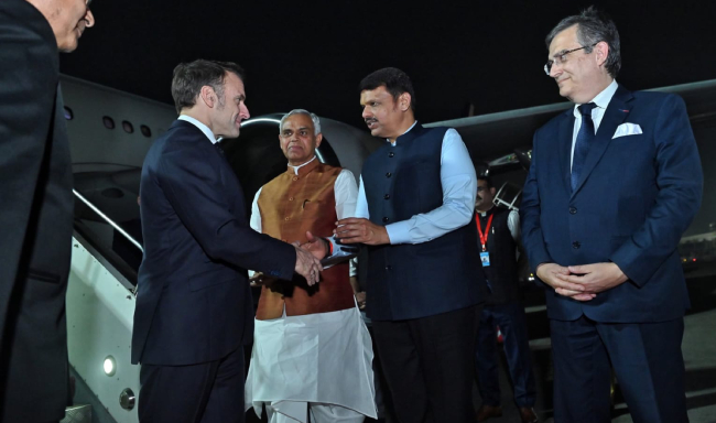 President of the French Republic, H.E. Mr. Emmanuel Macron received by Shri Acharya Devvrat, Governor of Maharashtra and Gujarat upon his arrival at the airport in Mumbai